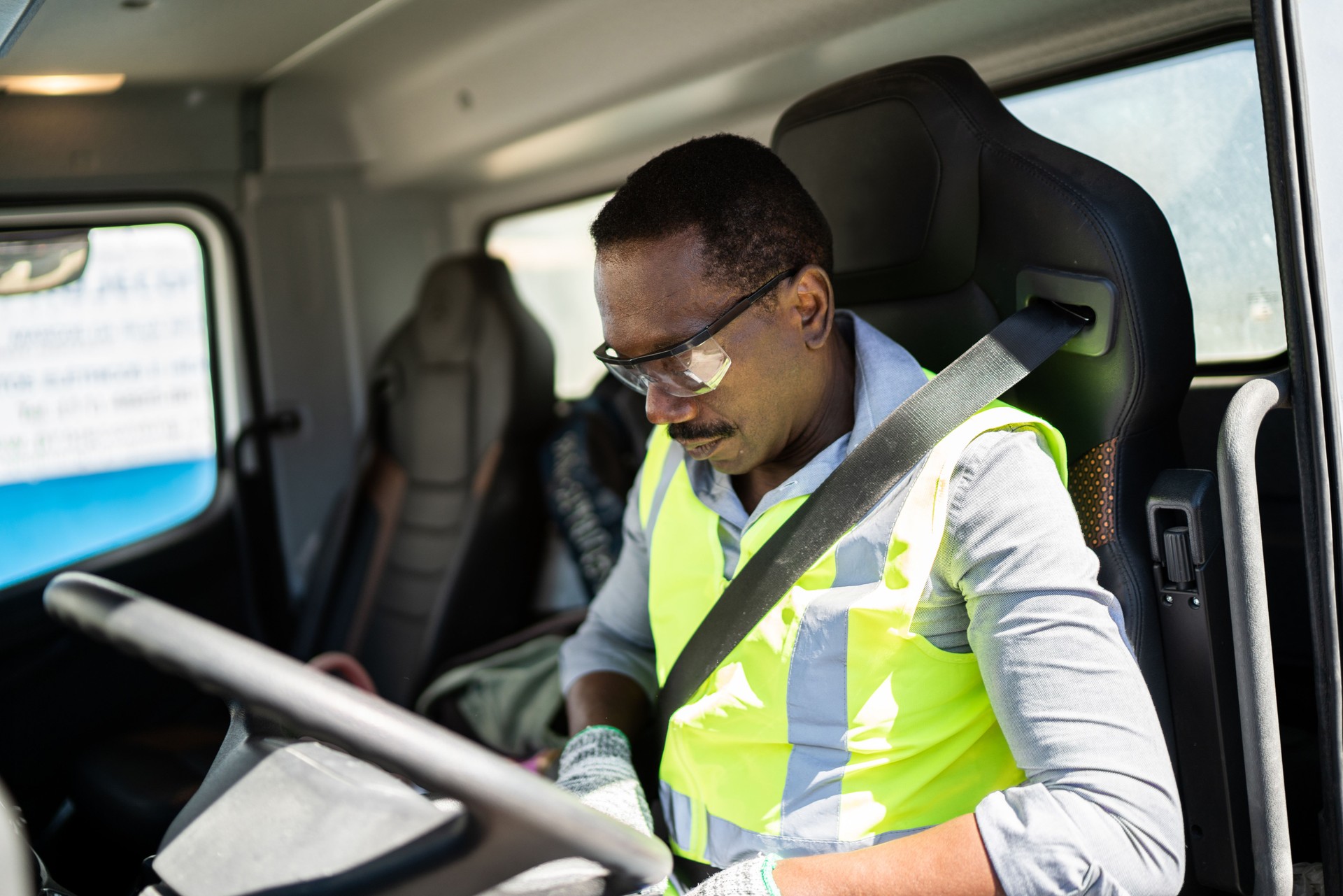 Trucker driver inside the truck at a construction site